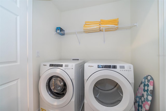 laundry room featuring separate washer and dryer