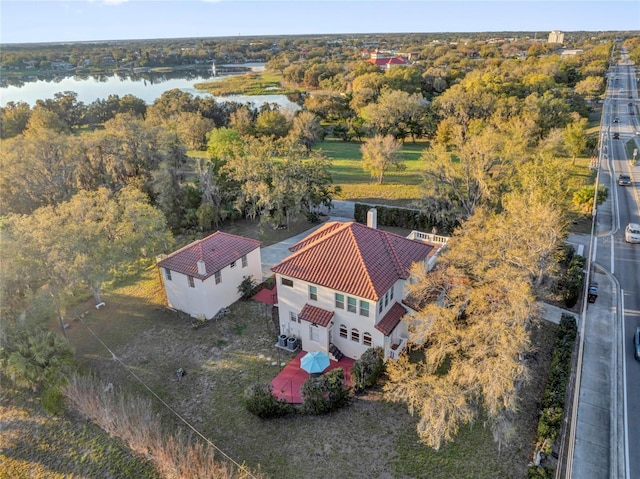 bird's eye view featuring a water view and a forest view