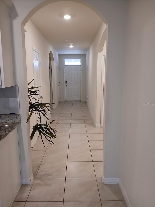 hallway featuring light tile patterned flooring