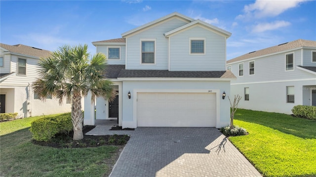 front of property featuring a garage and a front yard