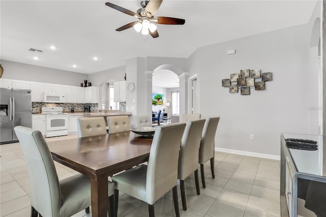 tiled dining room with ceiling fan