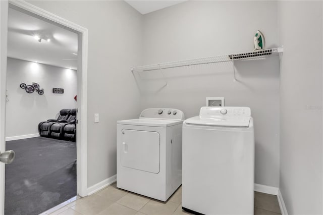 washroom with light tile patterned flooring and independent washer and dryer