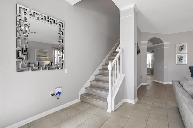 stairs with tile patterned floors