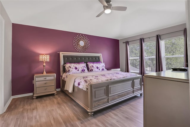 bedroom with dark wood-type flooring and ceiling fan