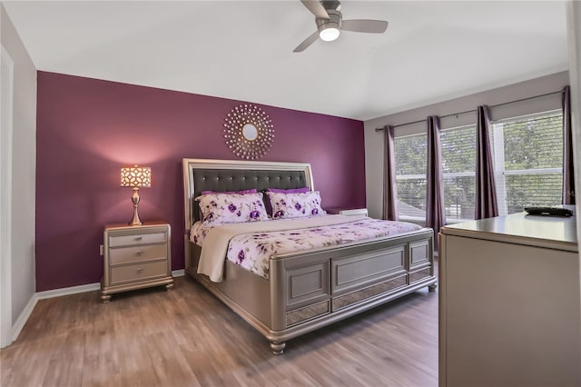 bedroom featuring ceiling fan and dark hardwood / wood-style flooring