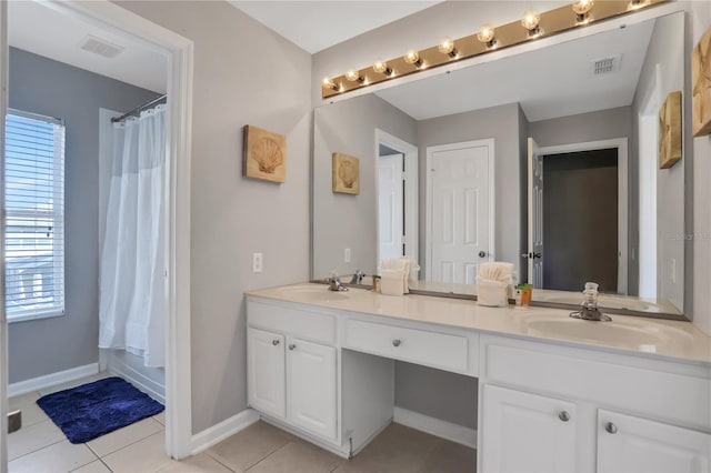 bathroom featuring vanity, shower / tub combo, and tile patterned flooring