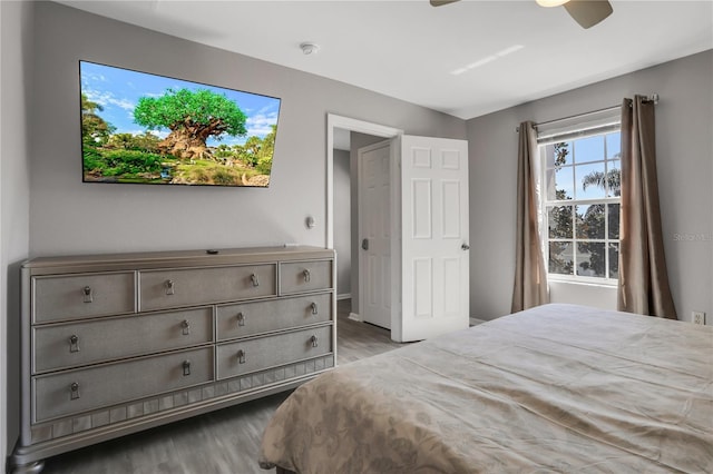 bedroom with ceiling fan and light hardwood / wood-style floors