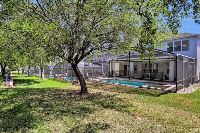 view of yard featuring a fenced in pool and glass enclosure