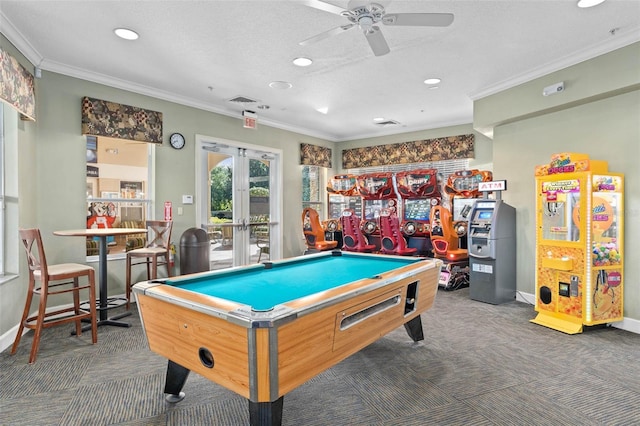 recreation room featuring dark carpet, ornamental molding, and french doors