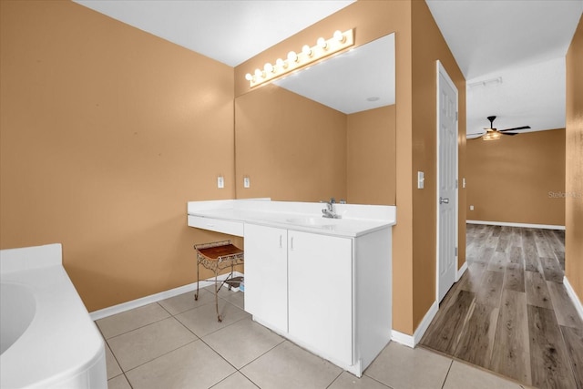 bathroom with ceiling fan, tile patterned floors, and vanity