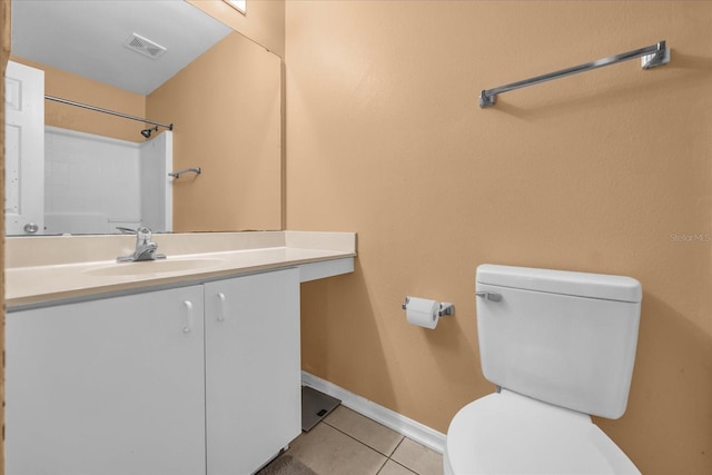 bathroom with vanity, toilet, and tile patterned flooring