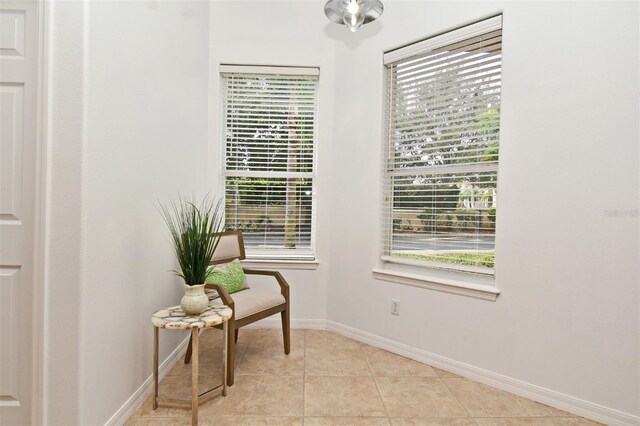8766 The Esplanade Unit 23, Orlando, FL 32836 - sitting room featuring light tile patterned flooring and baseboards