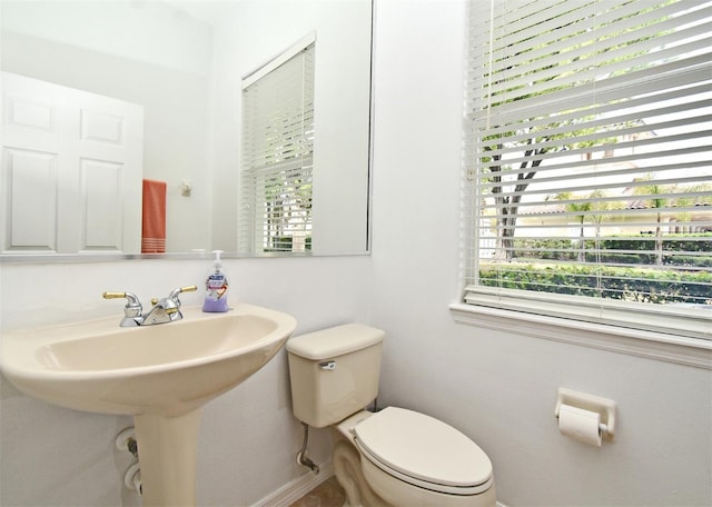 8766 The Esplanade Unit 23, Orlando, FL 32836 - half bathroom featuring baseboards and toilet