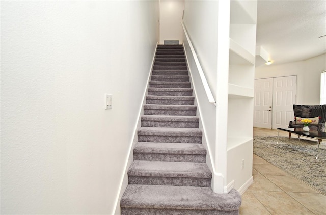 8766 The Esplanade Unit 23, Orlando, FL 32836 - staircase featuring tile patterned flooring