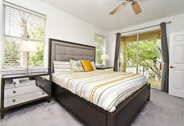 8766 The Esplanade Unit 23, Orlando, FL 32836 - carpeted bedroom with a ceiling fan and access to outside