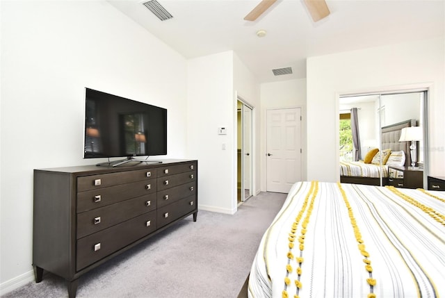 8766 The Esplanade Unit 23, Orlando, FL 32836 - bedroom featuring light carpet, baseboards, visible vents, and a ceiling fan