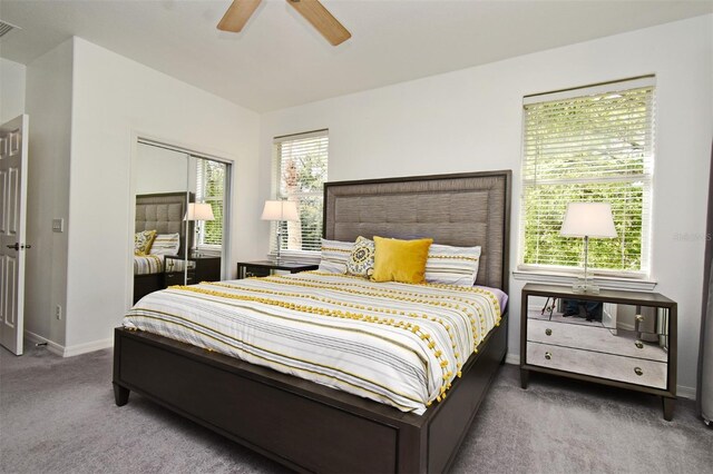 8766 The Esplanade Unit 23, Orlando, FL 32836 - bedroom featuring a closet, a ceiling fan, baseboards, visible vents, and carpet