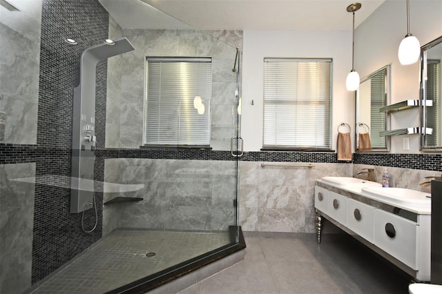 8766 The Esplanade Unit 23, Orlando, FL 32836 - full bath with tile walls, tile patterned floors, a sink, a stall shower, and double vanity