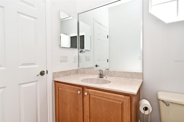 8766 The Esplanade Unit 23, Orlando, FL 32836 - bathroom with toilet and vanity