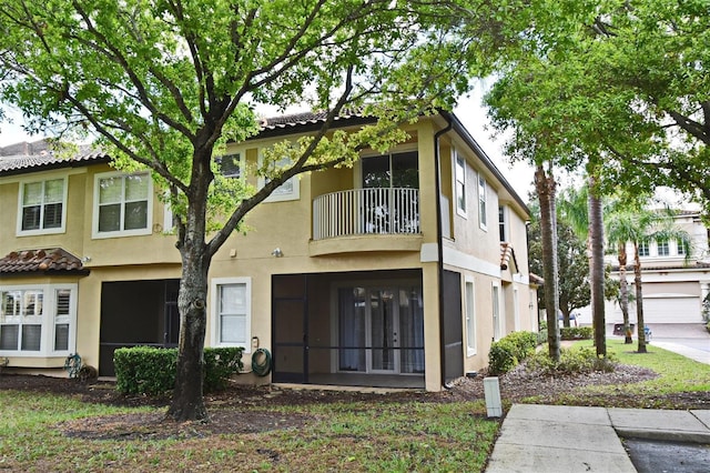 8766 The Esplanade Unit 23, Orlando, FL 32836 - view of front facade with a balcony and stucco siding