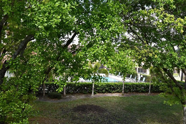 8766 The Esplanade Unit 23, Orlando, FL 32836 - view of yard featuring a community pool