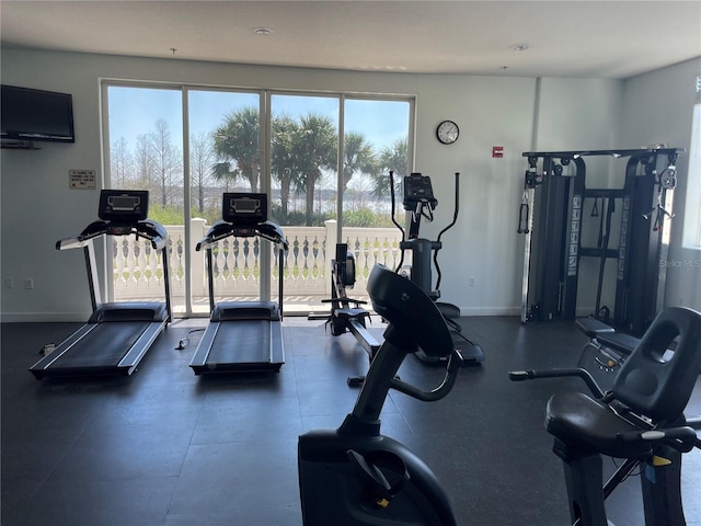 8766 The Esplanade Unit 23, Orlando, FL 32836 - gym featuring baseboards