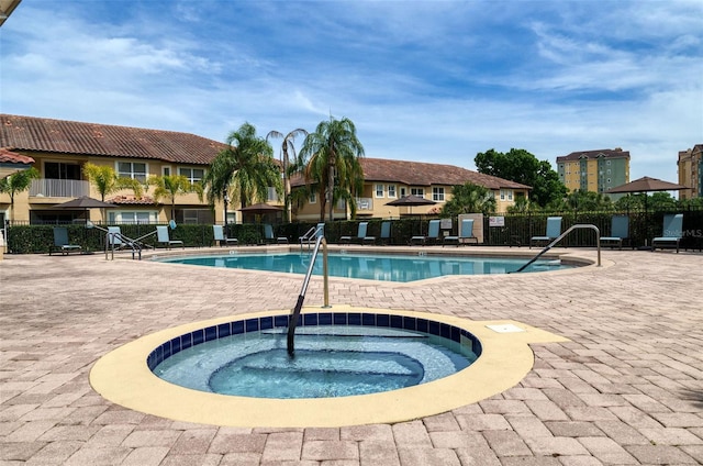 8766 The Esplanade Unit 23, Orlando, FL 32836 - pool with a community hot tub, fence, and a patio