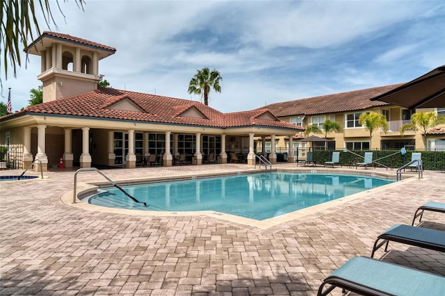 8766 The Esplanade Unit 23, Orlando, FL 32836 - community pool featuring fence and a patio area