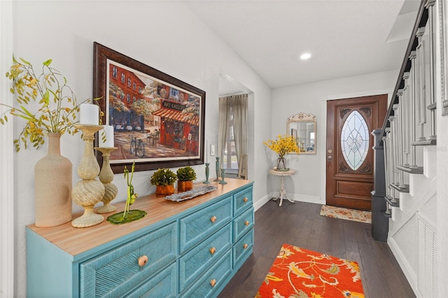 entrance foyer with dark wood-style floors, recessed lighting, stairs, and baseboards