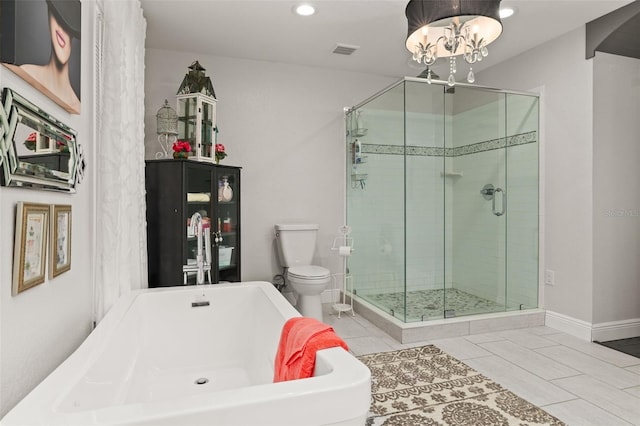 bathroom featuring a soaking tub, visible vents, toilet, an inviting chandelier, and a stall shower