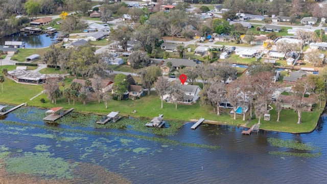 birds eye view of property with a residential view and a water view