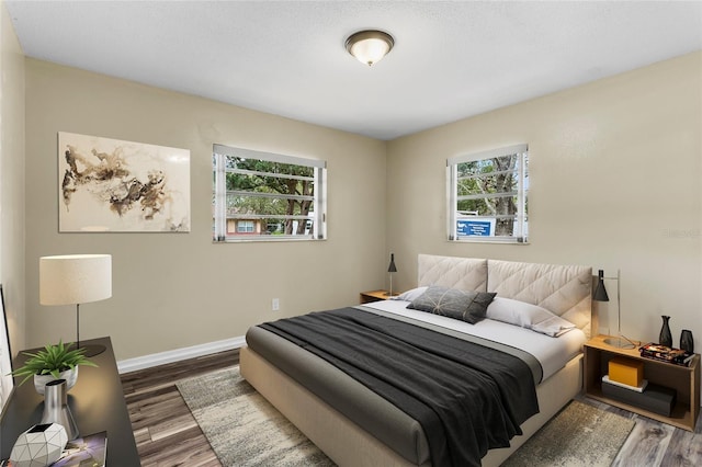 bedroom with hardwood / wood-style flooring