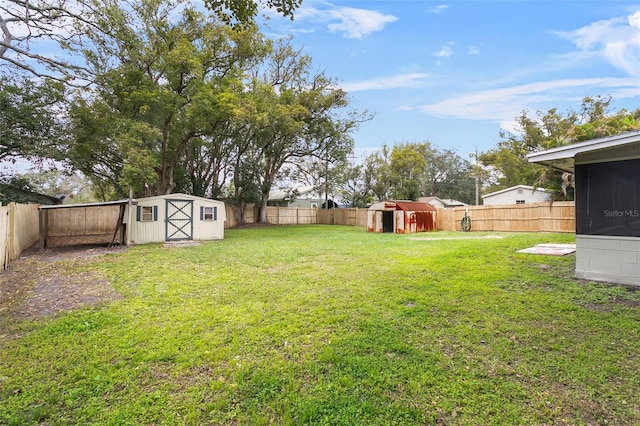 view of yard with a storage unit