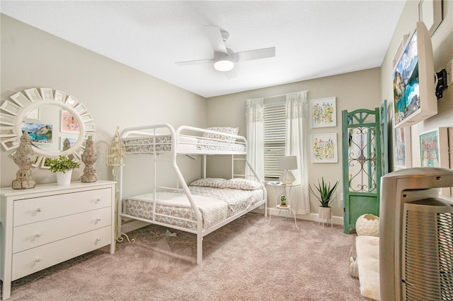 carpeted bedroom with multiple windows and ceiling fan