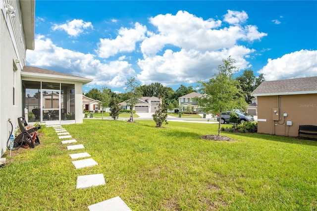 view of yard featuring a sunroom