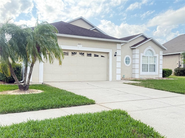 single story home featuring a front lawn and a garage