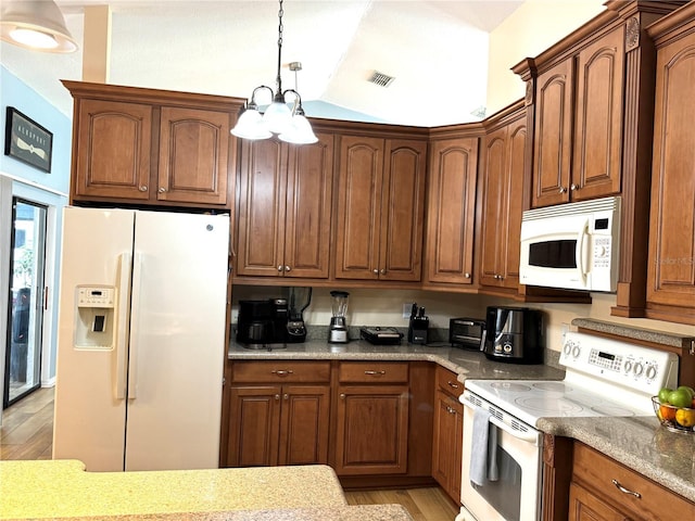 kitchen featuring white appliances, vaulted ceiling, light hardwood / wood-style flooring, pendant lighting, and light stone countertops