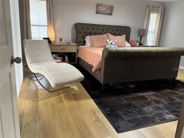 bedroom featuring dark hardwood / wood-style flooring