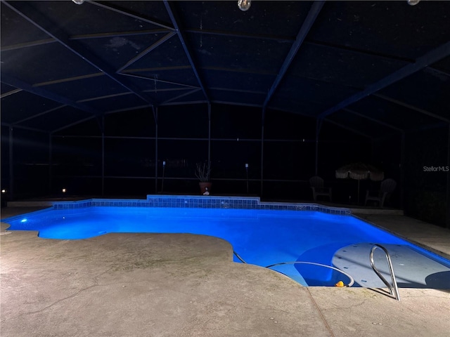 view of pool featuring a patio area and a lanai