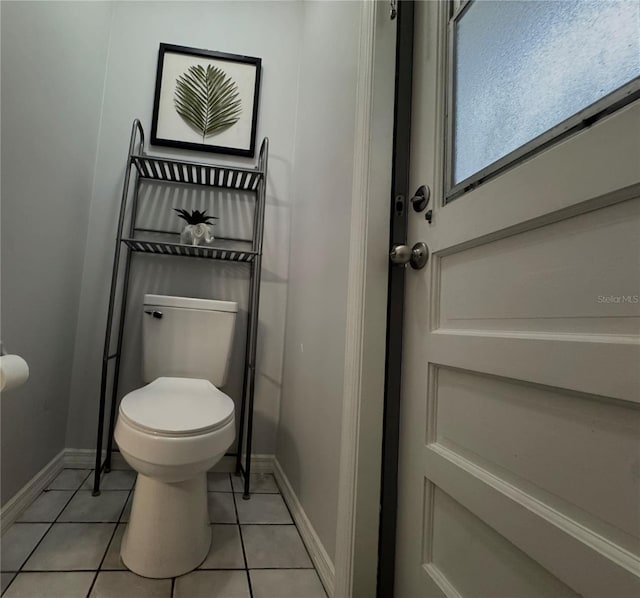 bathroom with tile patterned flooring and toilet