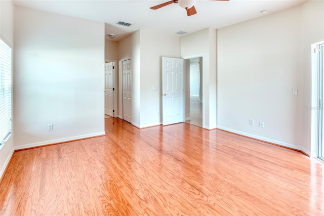 unfurnished bedroom with ceiling fan and light wood-type flooring