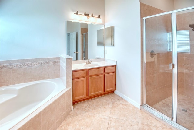 bathroom with tile patterned floors, vanity, and separate shower and tub