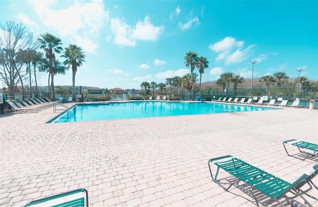 view of swimming pool with a patio