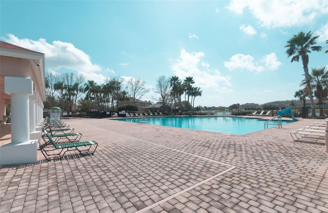 view of swimming pool with a patio