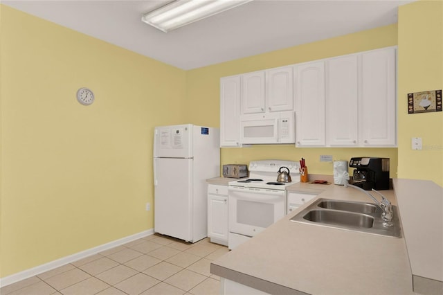 kitchen featuring light tile patterned floors, white appliances, a sink, and white cabinetry