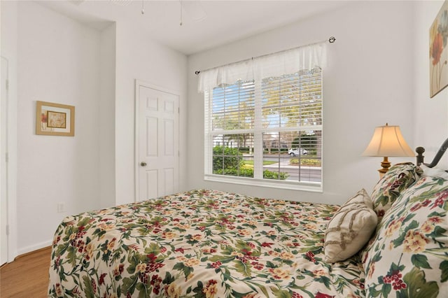 bedroom with wood finished floors