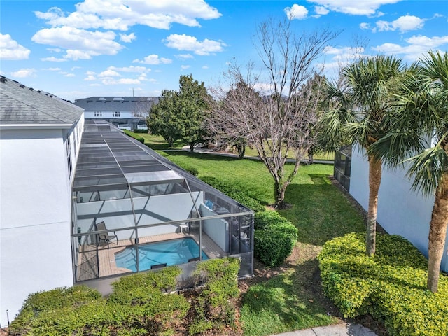 view of yard featuring a lanai and an outdoor pool