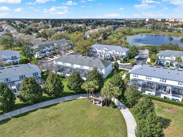 birds eye view of property featuring a water view and a residential view