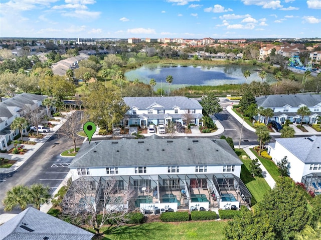 drone / aerial view featuring a water view and a residential view