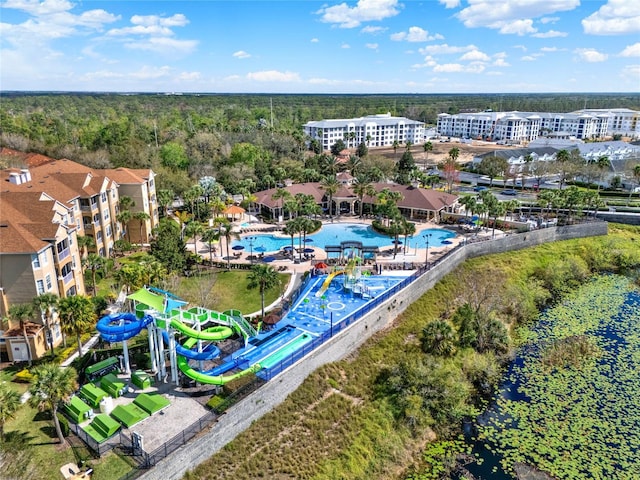 birds eye view of property with a wooded view